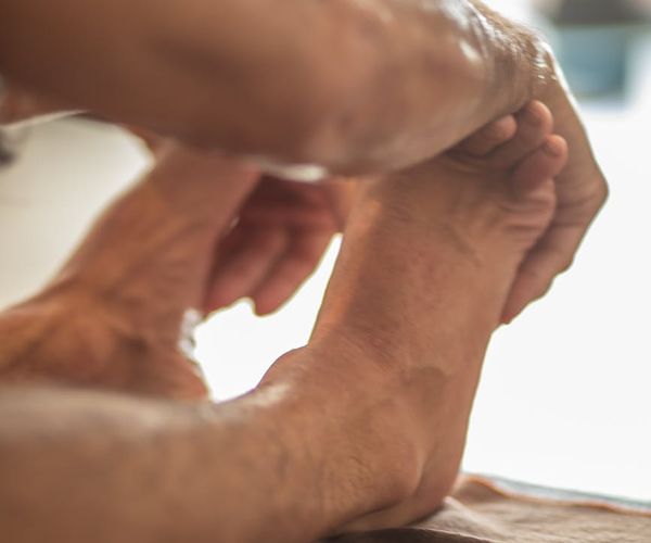 Person stretching peacefully, demonstrating improved flexibility and body awareness.